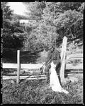 Partridge Hunter And His Dog Standing Near A Split Rail Fence by French George