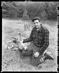 Hunter Kneeling Holding Up The Head Of An Eight Point Buck He Shot--Parsonsfield by French George