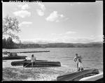 People Enjoying A Day At The Lake In Lovell, Mountains In Distance by French George