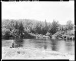 Man Standing On Shore Fishing, Trees In Background--Kennebago Stream by French George