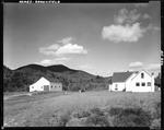 House And Barn In Country Setting In Brownfield With Burnt Meadow Mountain In The Background by French George