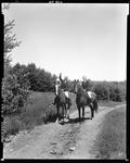 Two Women Horseback Riding On A Gravel Road In Jefferson by French George