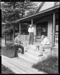 Three Men On Camp Porch One Has A Stringer Of Fish, Another Tells About The One That Got Away At Upper Dam by French George