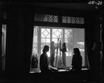 Two Young Women With Skis, Silhouetted In A Window At A Lodge In Poland Spring by George W. French
