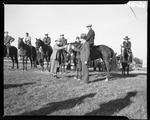 Man And Woman Holding Trophy, Group Of Riders In Background by George W. French
