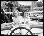 Two Young Women At The Wheel Of A Schooner by George W. French