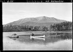 Man In A Canoe On A Pond, Mount Katahdin In Background by George W. French