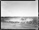 Worker Using A Tractor To Spray Potato Fields In Caribou by George French