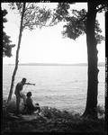 Couple Sitting On The Shore Of A Lake In Jefferson by George French