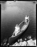 Two Women In A Canoe Near Shore In Kezar Falls by George French