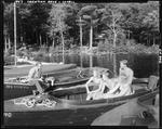 Man Taking A Photo Of Two Young Couples In A Boat On A Lake In Lovell by George French