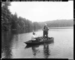 Two Men Fishing From Boat, One Netting Catch For Other At Long Pond In Parsonsfield by George French