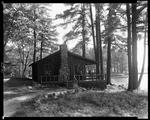 People Sitting On Porch Of Lakeside Cottage On Lake Kezar by George French