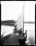 Couple Getting Ready To Go Out Sailing On A Lake In Waterboro by George French