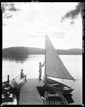 Couple Getting Ready To Go Sailing On A Lake In Waterboro In Late Afternoon by George French