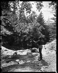 Man Fishing In Stoneham Brook In A Rocky Area Of The Stream by George French