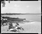 Two Young Women Sitting On The Beach At East Sebago by George French