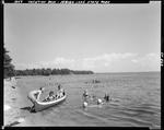 Three Girls Going On A Canoe Ride, Others In Water Swimming At Sebago State Park by George French