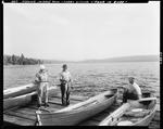 Three Men On A Dock Talking To Another Sitting In A Boat At Middle Dam by George French
