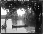 A Couple In A Canoe Meeting Another Boat On Lake Kezar In North Lovell by George French