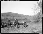 Duck Hunters Sitting On A Trailered Canoe In Porter by George French