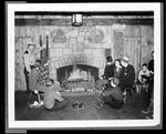 People Gathered Around The Fire At A Ski Lodge by George W. French