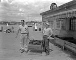 Two Men Holding A Crate Of Lobsters In Boothbay Harbor by George French