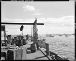 Two Men On A Dock, People In Background, One Of The Men Throwing Something Off The Dock At Cape Porpoise by George French
