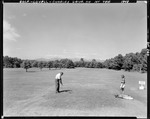 Couple Playing Golf In Lovell by George French