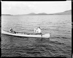 Two Men In A Boat In The Middle Of Moosehead Lake, One Holding A Fish by George French