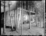 People Sitting On Camp Porch In Late Evening At Moosehead Lake by George French