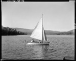 Man And Two Boys In Small Sailboat On A Lake In Porter by George French
