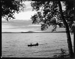 Canoeists On Rangeley Lake, Mountains In Background by George French