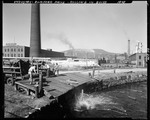 Workers Offloading Pulpwood Into A Mill Pond In Rumford Falls by George French