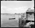 Fisherman's Wharf And Shop At Bailey Island, Harbor In Background by George French