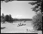 People Enjoying A Day Around And On The Water At A Lake In Lovell by George French