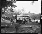 Unloading Four Canoes From A Trailer In Porter by George French