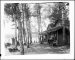 Folks Enjoying A Lazy Afternoon On Camp Porch by George French