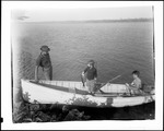 Two Boys In A Boat Near Shore, One Holding A Fish He Caught While Talking To A Man On Shore by George French
