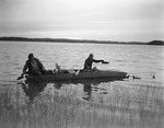 Two Hunters Setting Decoys From A Camouflaged Boat In Merrymeeting Bay by George French