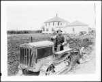 Farmer On A "Caterpillar" Tractor Preparing To Work A Field by George French