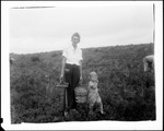 A Woman And Child In A Blueberry Field by George French