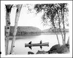 Two Men Fishing From Canoe On Lake In Greenwood by George French