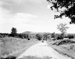 Gravel Road With View Of Scenic Mountains In Hiram by George French