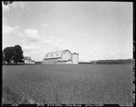 Large Barn With Silo As Seen From Across A Field "Bean And Allen Seed Potatoes" In Aroostook by George French