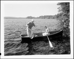 Two Men Fishing From A Boat On Long Lake, One Netting Catch In Naples by George French