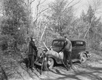 Two Hunters Tying Eight Point Buck To Fender Of A Car by George French
