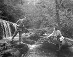 Man & Woman Stream Fishing, She Netting His Catch by George French