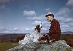 Hunter And His Dog Sitting On Ledge At End Of Day by George French