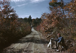 Man And Dog Sitting Beside Dirt Road In Fall, They Have Been Partridge Hunting, Old County Road Porter To Cornish Through Parsonfield by George French